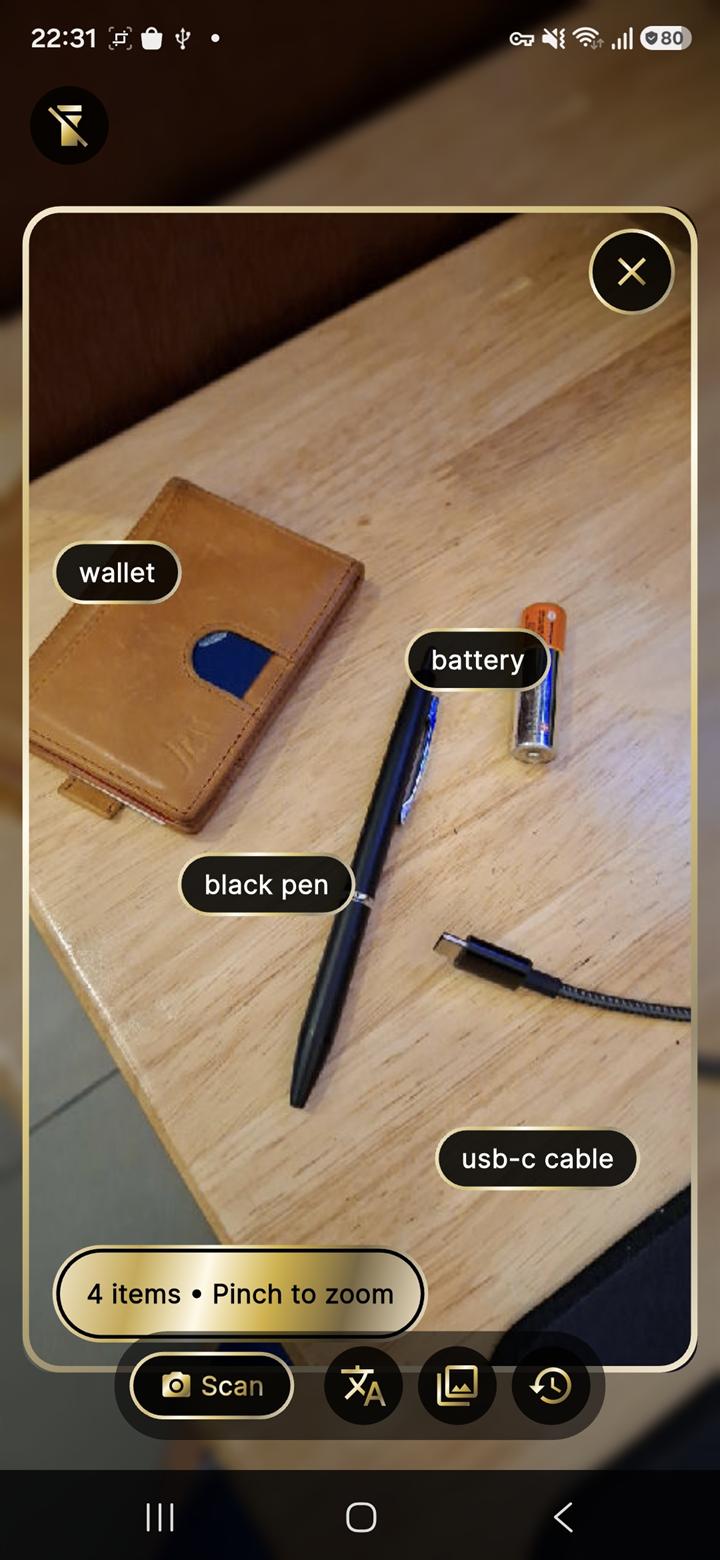 Scan mode: analyzed photo with item labels on wallet, pen, battery, and cable
